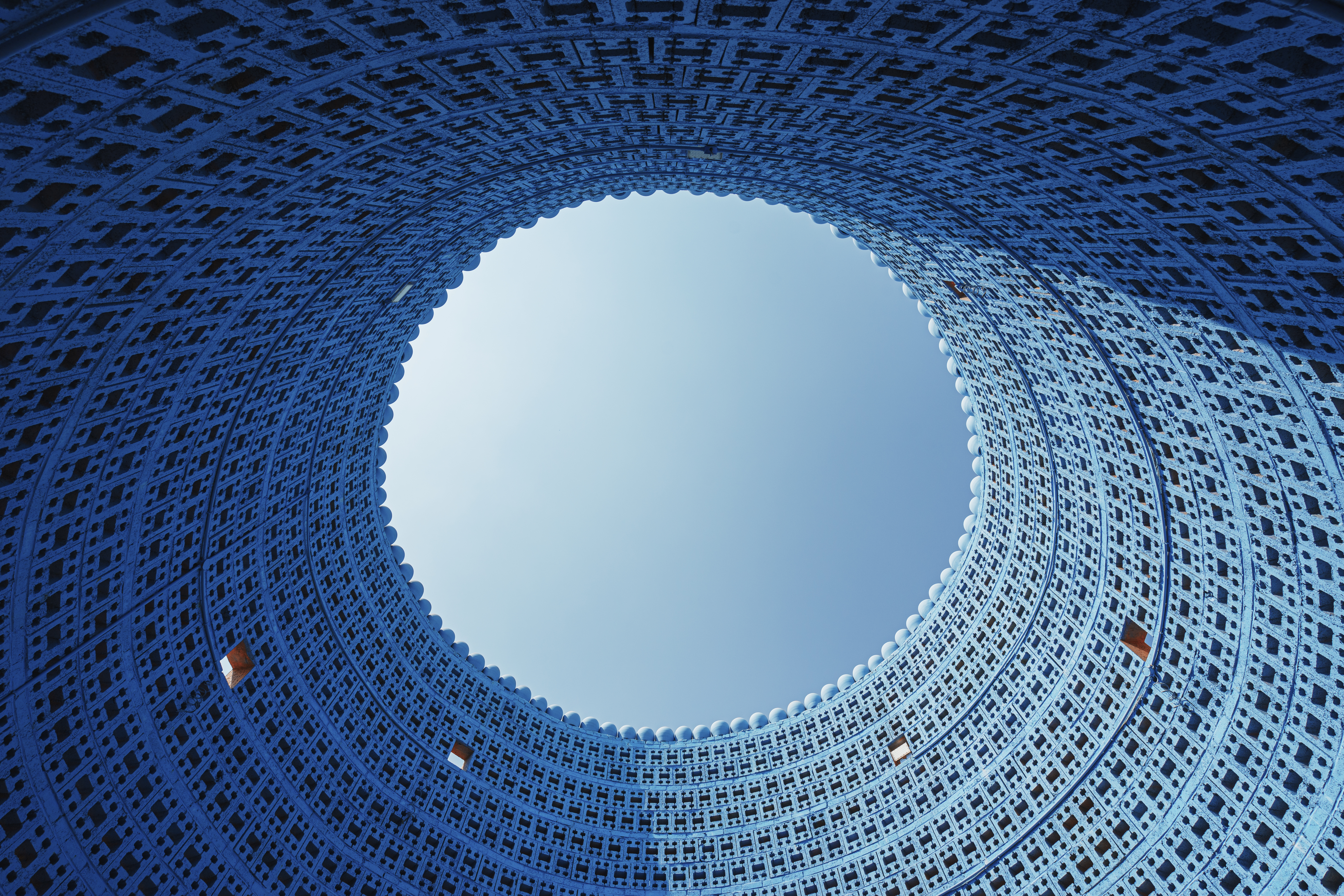 Corporate headquarters tower with blue glass envelope